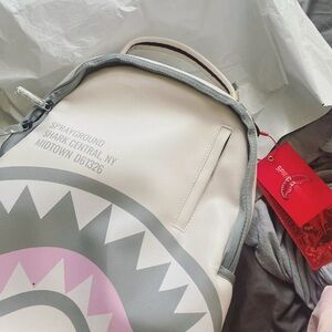 Sprayground White and Pink Shark Backpack